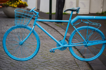 Fototapeta na wymiar Blue colored bike at a street