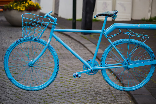 Blue colored bike at a street