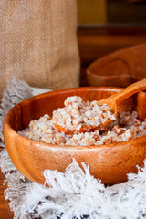 Fototapeta na wymiar Boiled buckwheat in a wooden bowl, Selective focus