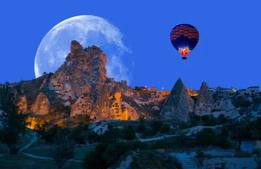 Rolgordijnen Hot air balloon flying over spectacular Cappadocia "Elements of this image furnished by NASA" © muratart