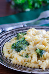 Pasta with cheese sauce and broccoli, selective focus