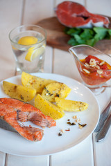 Grilled salmon steak with potatoes