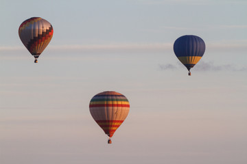 Colorful hot-air balloons flying over the mountain