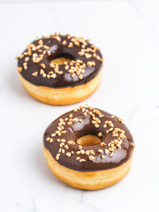Tasty classic donuts on white background