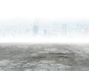 Concrete floor and city background with mist