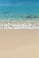 Fototapeta na wymiar Tropical beach with sand and aqua marine turquoise water. Taken in the Caribbean island of Grand Turk.