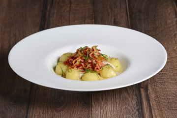 Plate with gnocchi, smoked bacoPlate with gnocchi, smoked bacon