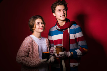 Lovely winter young couple in the studio. Winter love