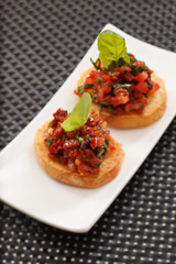 bruschettas with chopped tomato and basil