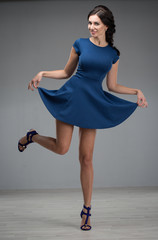 beautiful young woman in a blue dress