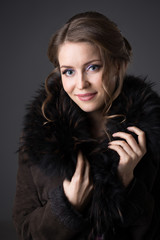 woman in a black fur coat
