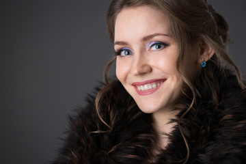 woman in a black fur coat