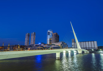 Argentina, Buenos Aires Province, City of Buenos Aires, Twilight view of Puente de la Mujer in Puerto Madero.