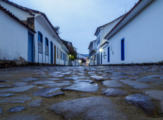 Brazil, State of Rio de Janeiro, Paraty, Twilight view of the cobble stone lane of the Old Town.
