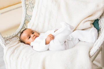 Laughing Mixed Race Baby Boy Lying At Home