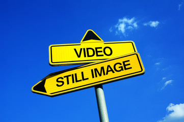 Video vs Still Image - Traffic sign with two options - using camcorders and shoot films, clips and...