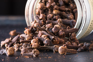 Whole Cloves Spilled from a Spice Jar