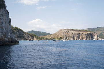 Fototapeta na wymiar Boats moored in a beautiful inlet, Marina di Camerota, Italy