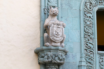 Animal stone frieze on a column.