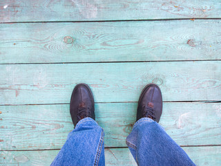 Feet on the wooden floor.