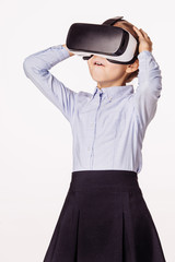 schoolgirl with virtual reality headset. Innovation technology a