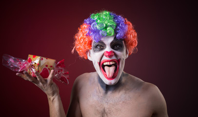 scary clown with spooky makeup and more candy