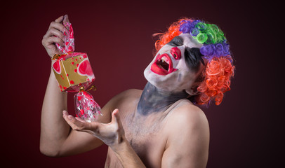 scary clown with spooky makeup and more candy