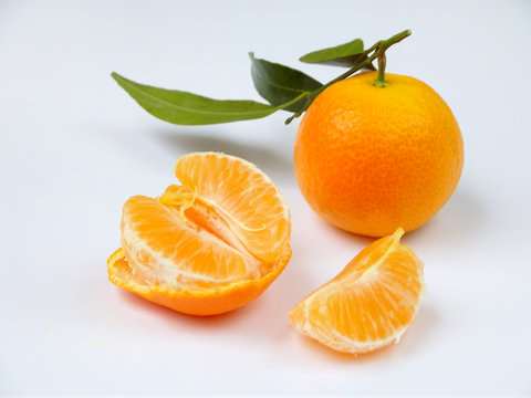 ripe juicy tangerines on a white background. selective focus.