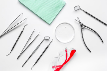 dentists tools in cabinet on white desktop top view