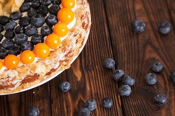 cake with berries on the wooden table