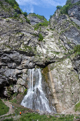 Huge Gegsky waterfall flowing from the cliff. Abkhazia