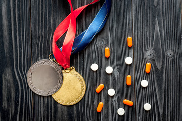 Concept of doping in sport - deprivation medals top view