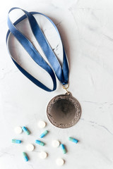 Concept of doping in sport - deprivation medals top view