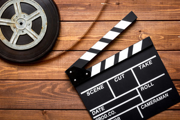 Work screenwriter on wooden background top view