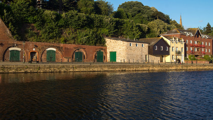 Fototapeta na wymiar cellars and houses on Exeter Quay. Exe river. Devon. UK