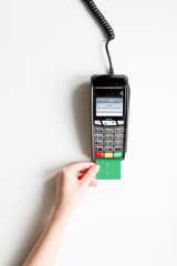 payment terminal with card on white background top view