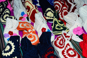 Fototapeta na wymiar Knitted slippers laid out on a counter