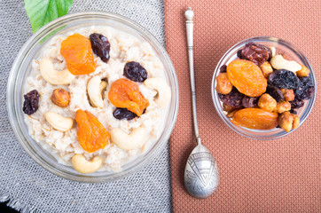 Top view of a portion of oatmeal with fruit and berries