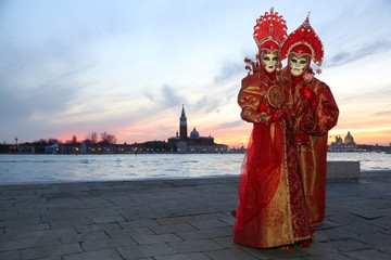 Venice Carnival 2 masked persons with red costumes