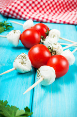 Cherry tomatoes with mozzarella on a stick