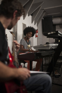 Musicians rehearsing in a recording studio
