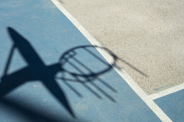 Detail of shadow of basketball hoop with iron net © lobro