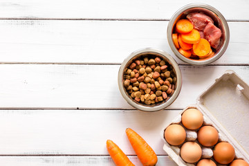 ingredients for pet food holistic top view on wooden background