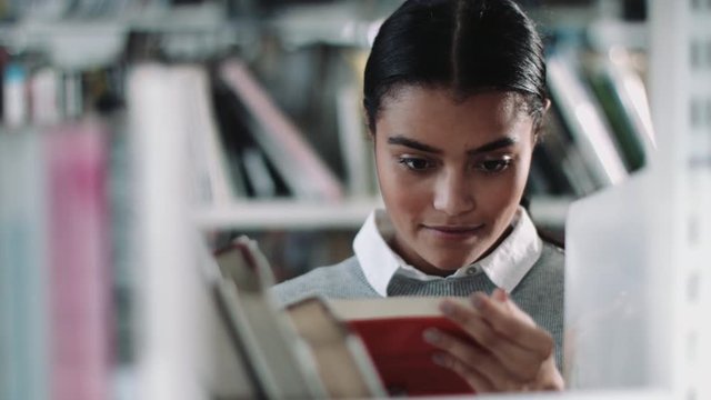 Student reading in a library