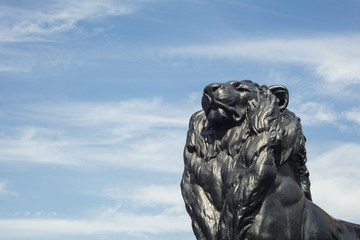 Detail of statue of a king lion, which belongs to Christopher Columbus Monument in Barcelona, Spain