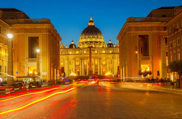 Fototapeta na wymiar road with car tile lights to St. Peter's cathedral in Rome at night, Italy