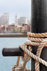 Heavy ropes secure a ship on the Charlestown side of Boston Harbor
