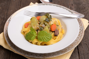 organic dish with zucchini noodles and carrots spinosa