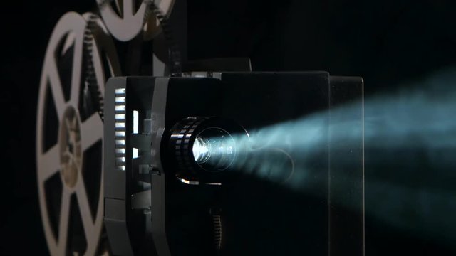 Close up of a vintage movie projector. Projection rays