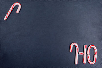Holiday striped candy cane with text HO